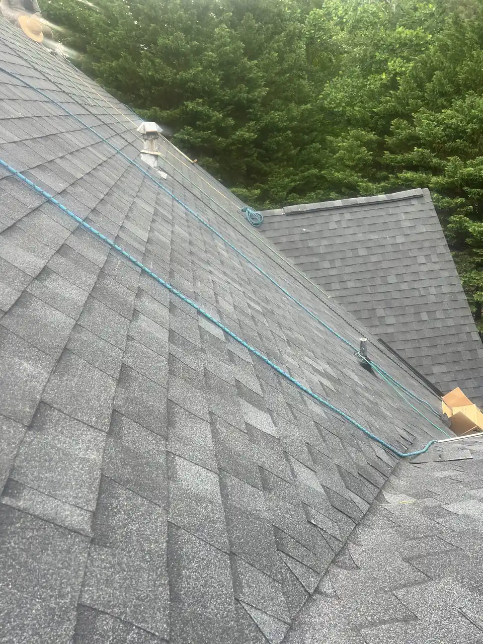 Architectural shingles on a hip roof with clean lines
