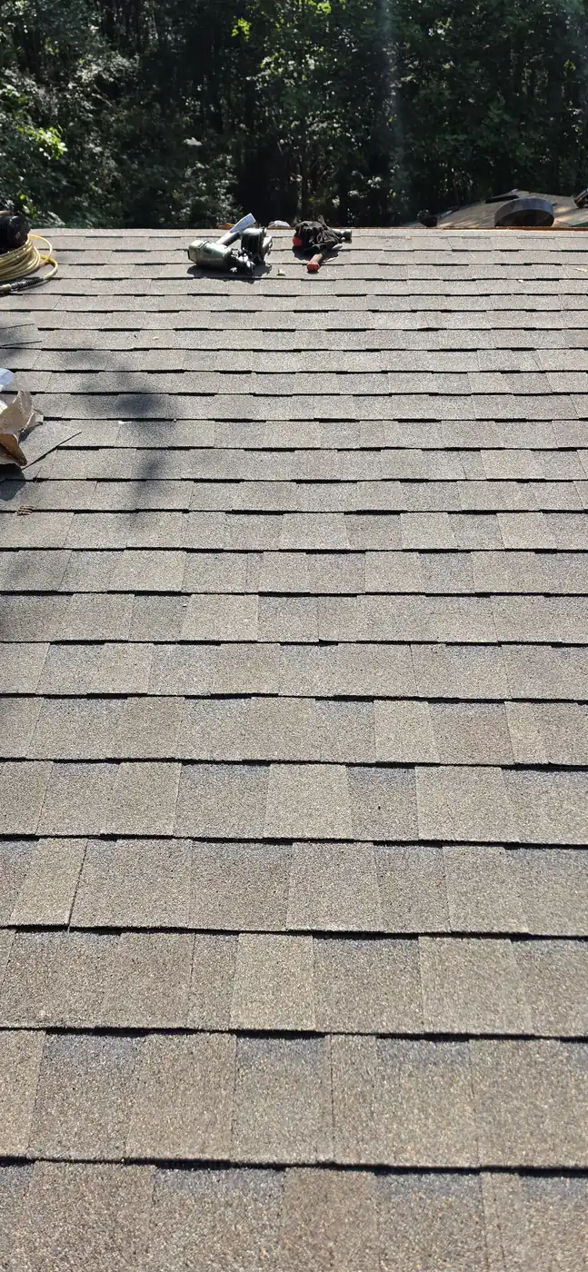 Clean rake edge on a finished asphalt shingle roof