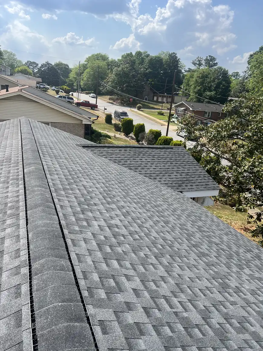 New gray shingle roof above a Covington neighborhood street