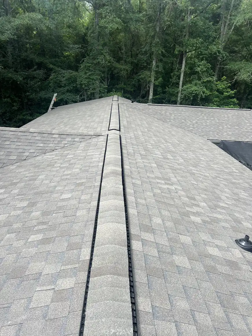 Ridge vent running along a newly installed shingle roof
