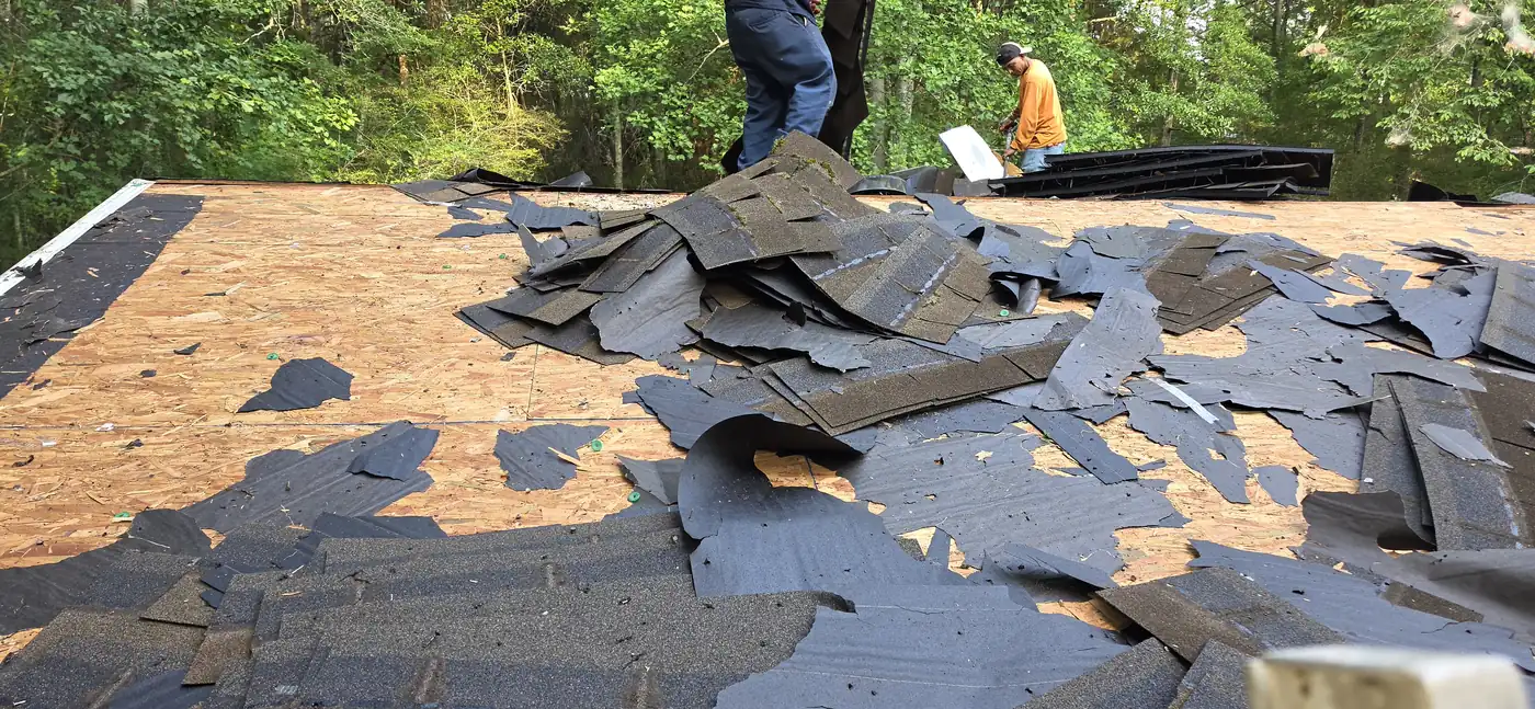 Old shingles removed to expose the roof decking